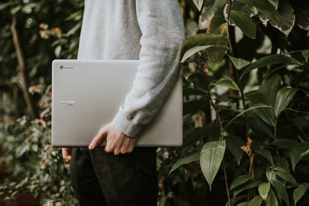 a person holding computer I saw you flirting
