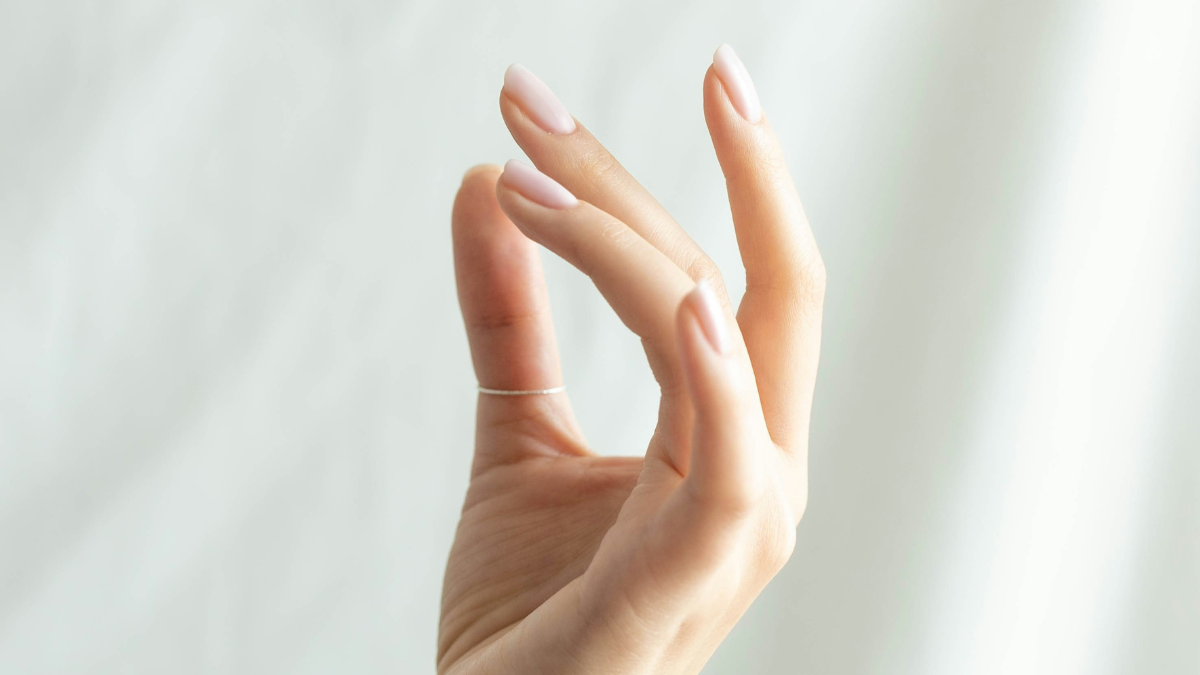 person holding fingertips thinking she can't fix everything