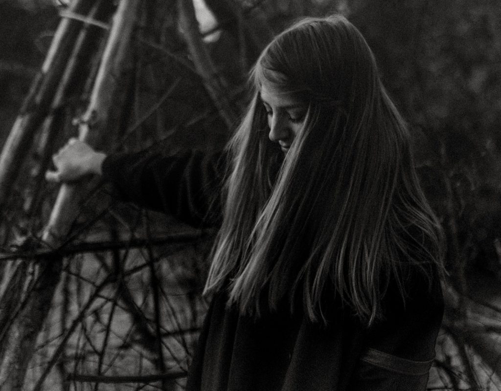 girl with head down thinking i am imperfect