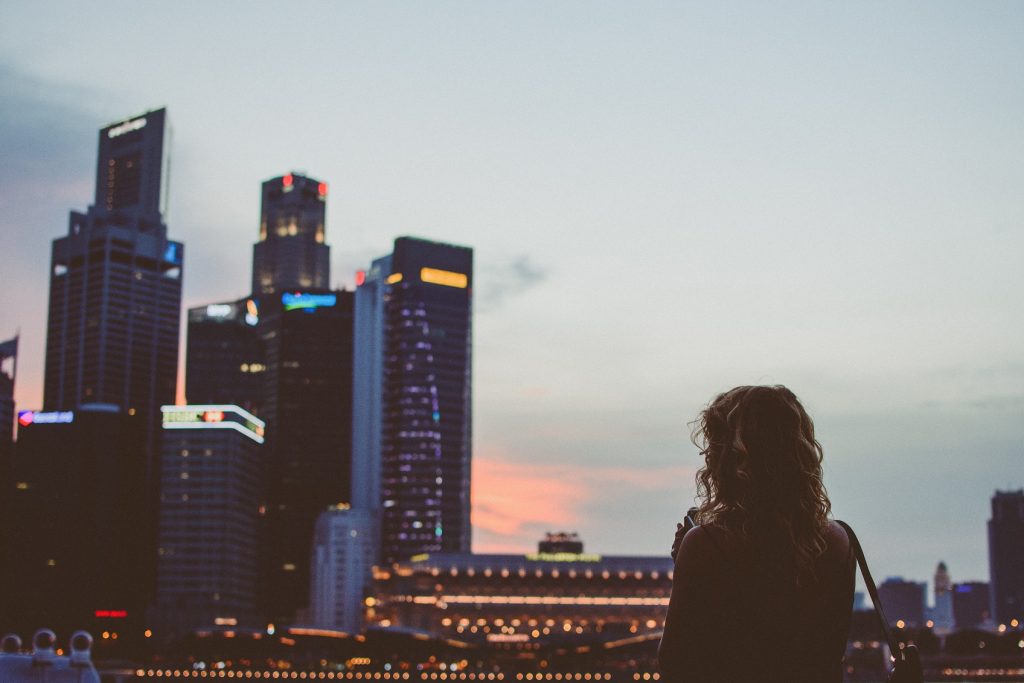 girl looking out at city skyline
