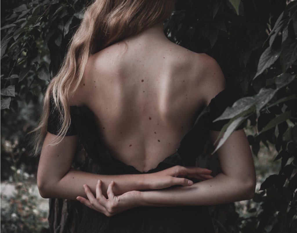 happy woman holding herself in self-love