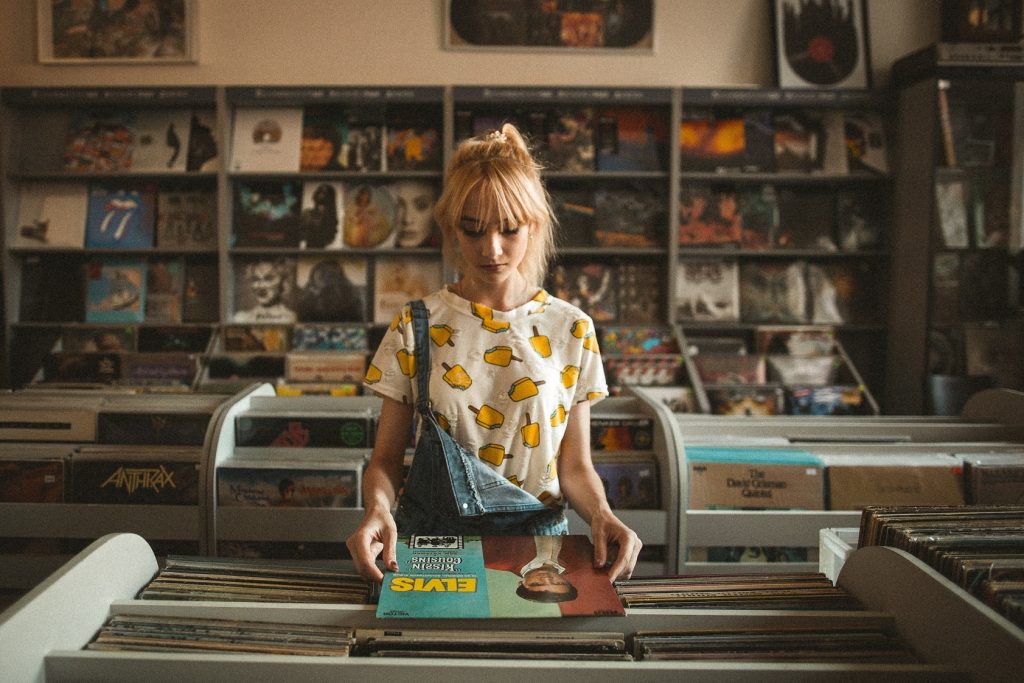happy girl looking at albums