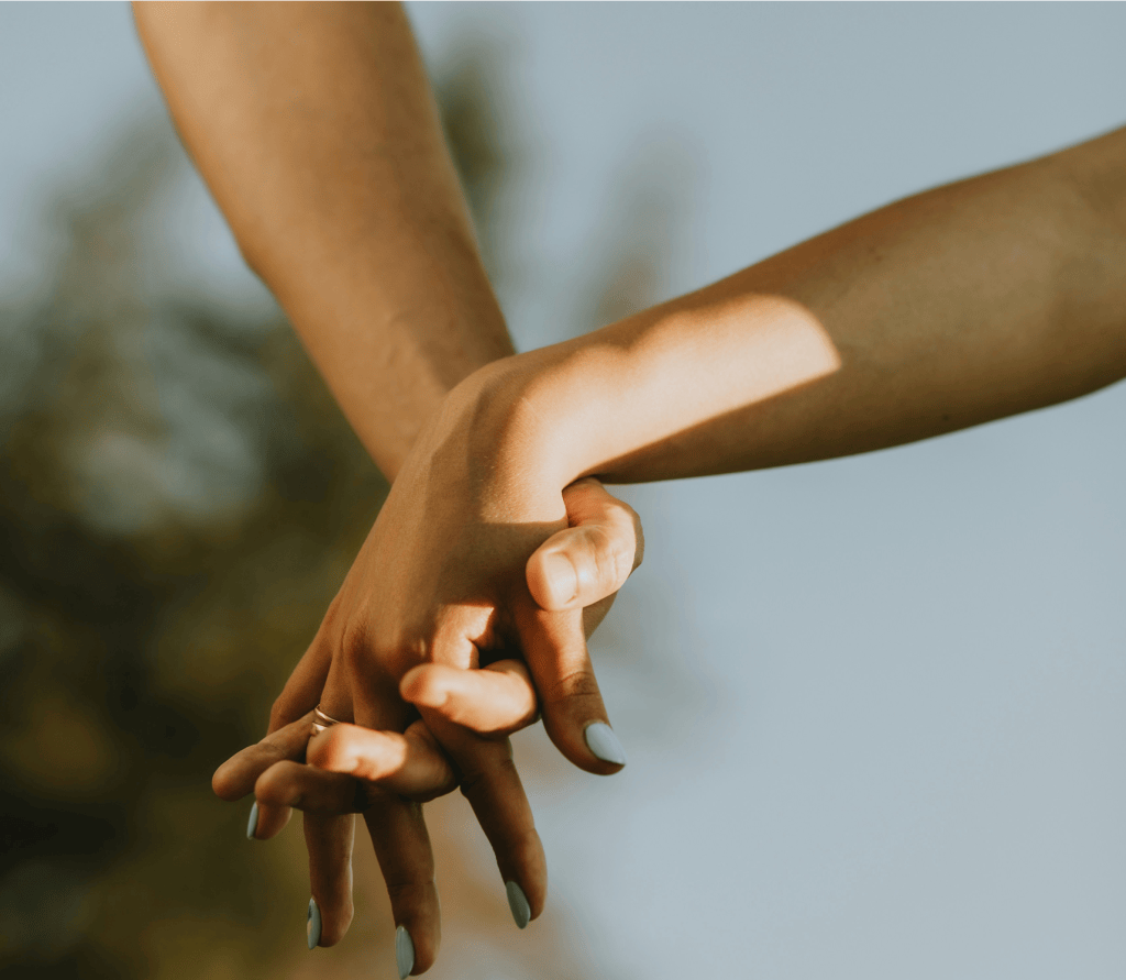 interracial couple holding hands