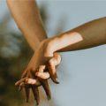 interracial couple holding hands