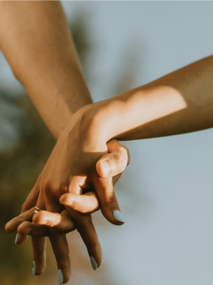 interracial couple holding hands