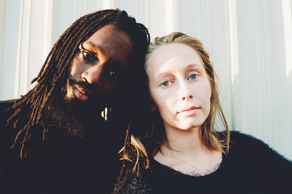 couple looking at camera with serious faces