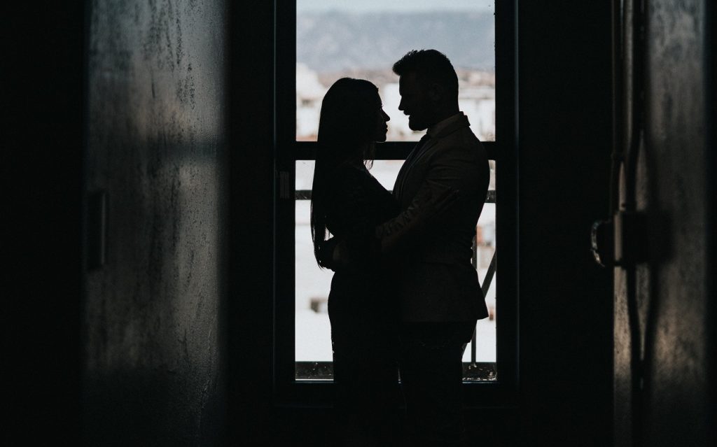 silhouette couple in doorway