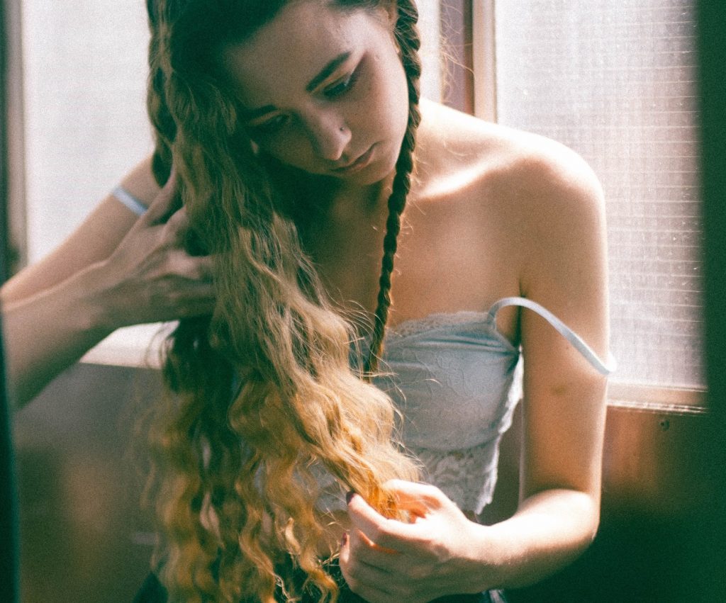 girl brushing her hair knowing you are not alone