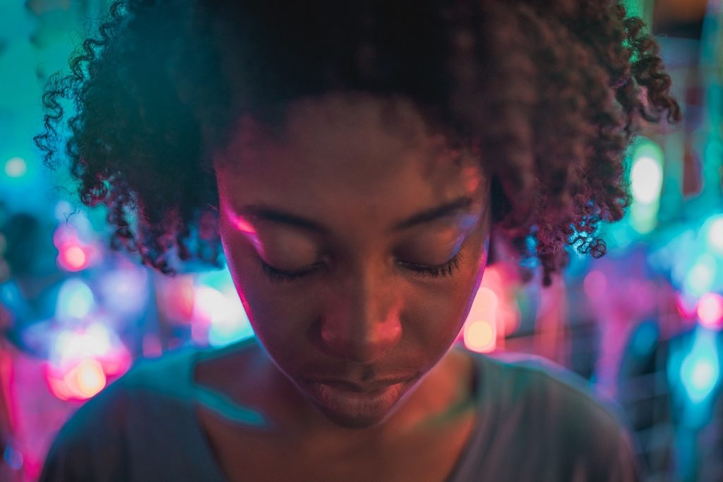 woman looking down serious face