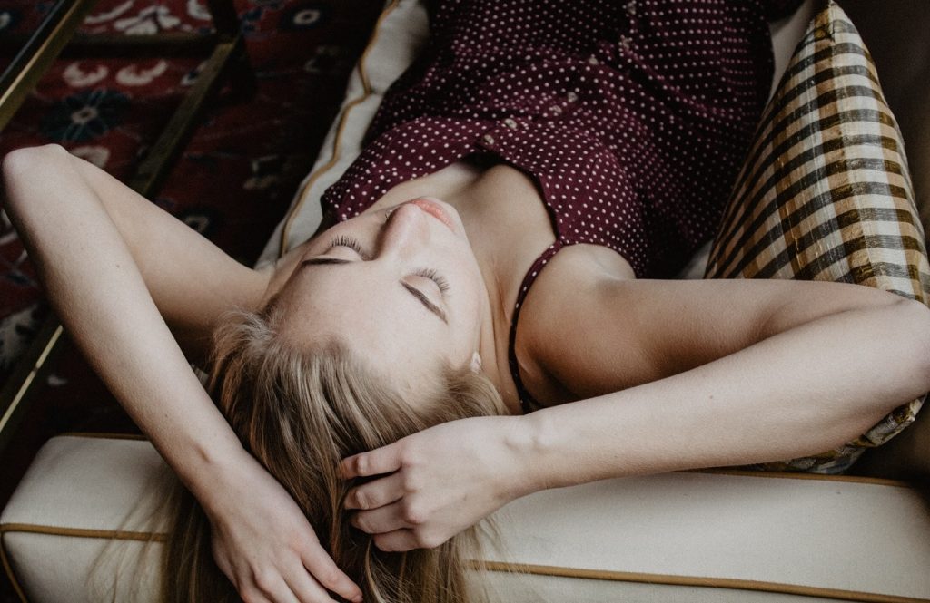 girl leaning over a couch, healing reminders for anyone who feels stuck