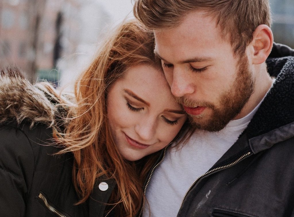 girl leaning on guy's chest