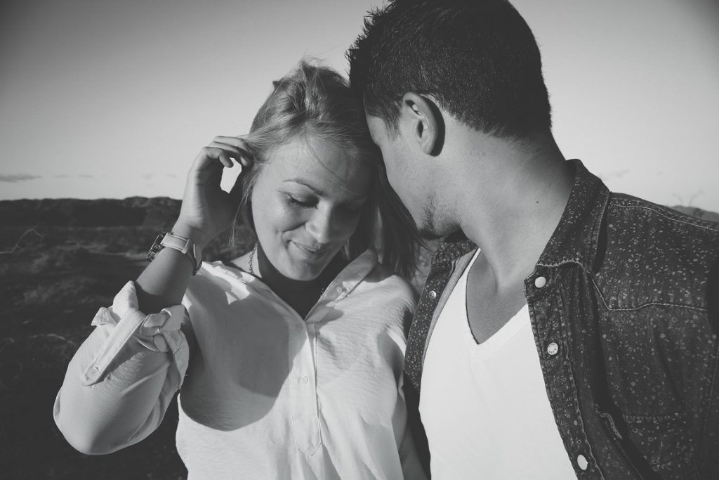 couple looking at one another in black and white