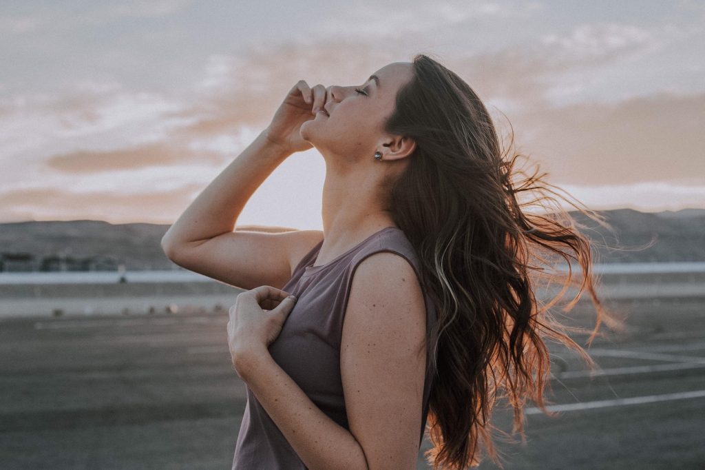 girl looking up at sky with serious smile