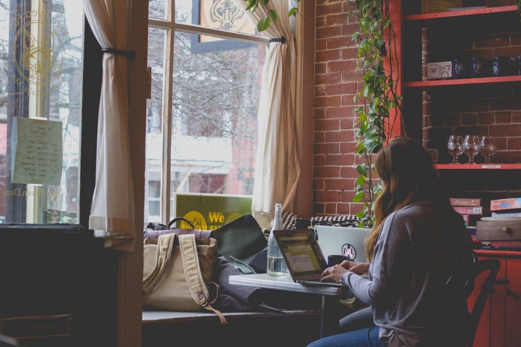 woman typing at desk, this week's reading list