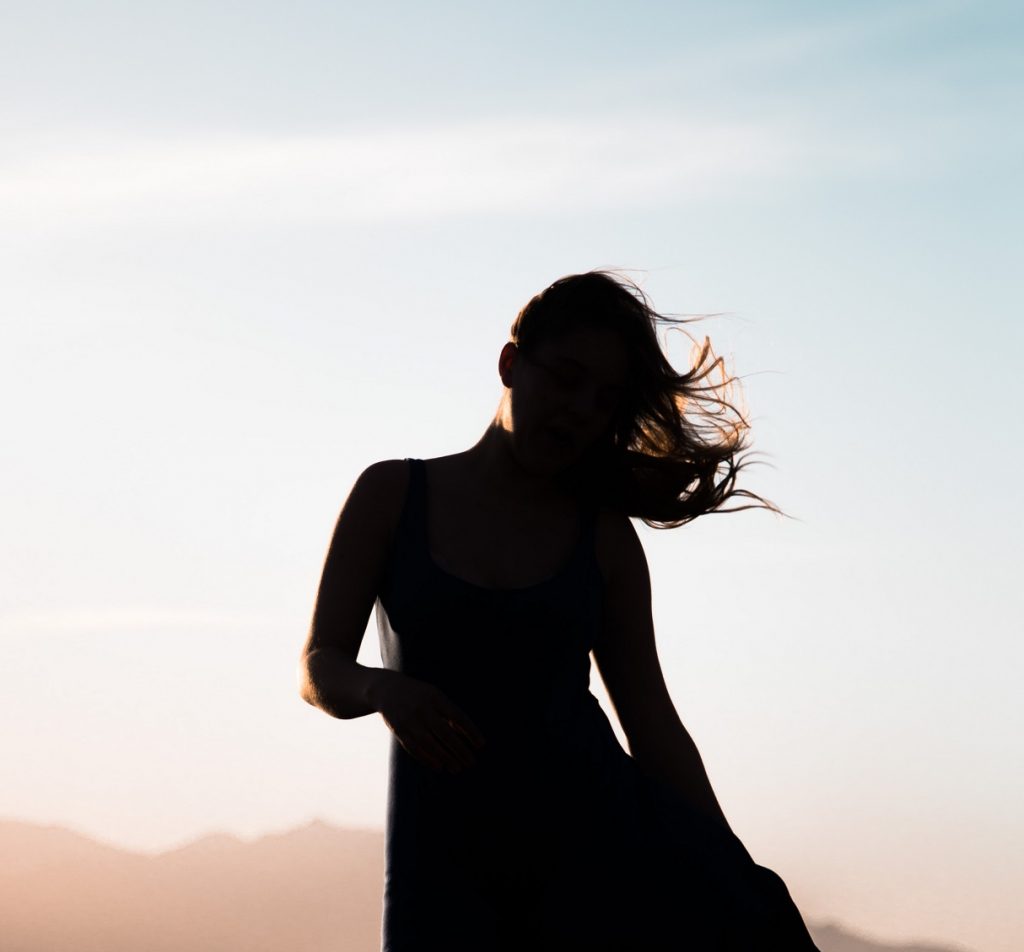 silhouette of woman in sunset, encouraging reminders for high school students