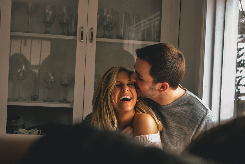 couple laughing, guy kissing forehead, i want every uncomfortable moment with you