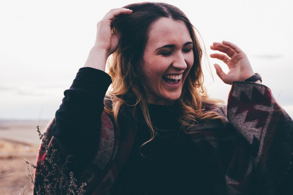 happy woman smiling, things that happen when you start loving yourself