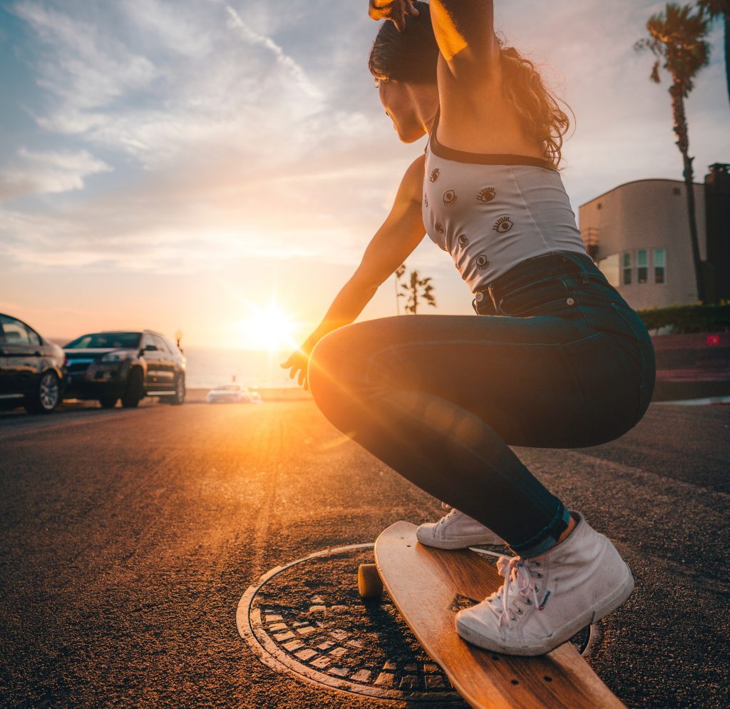 pursue your dream life, happy woman skateboarding