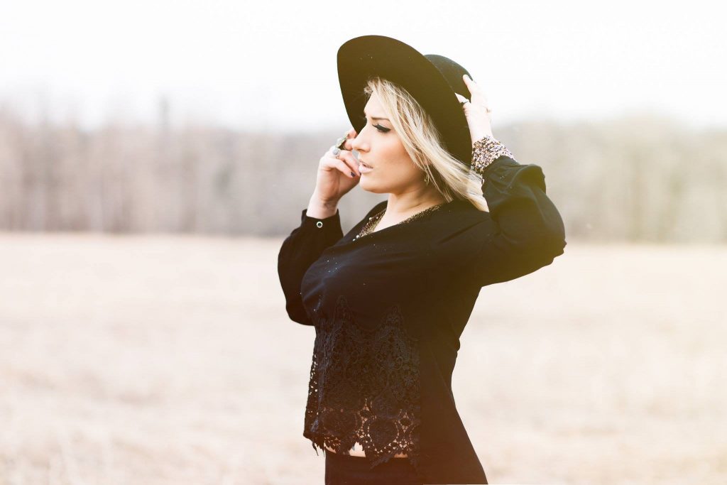 honoring your inner witch, girl with hat looking into sky