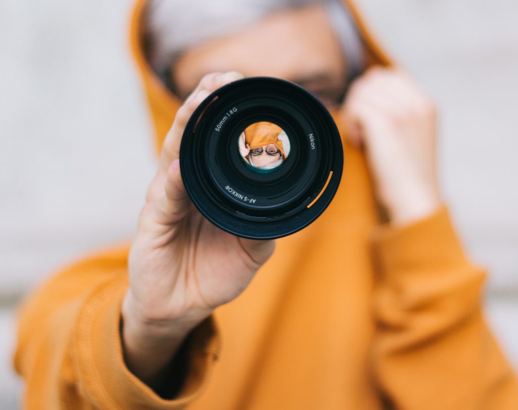 best the best you that you can, person looking through camera lens