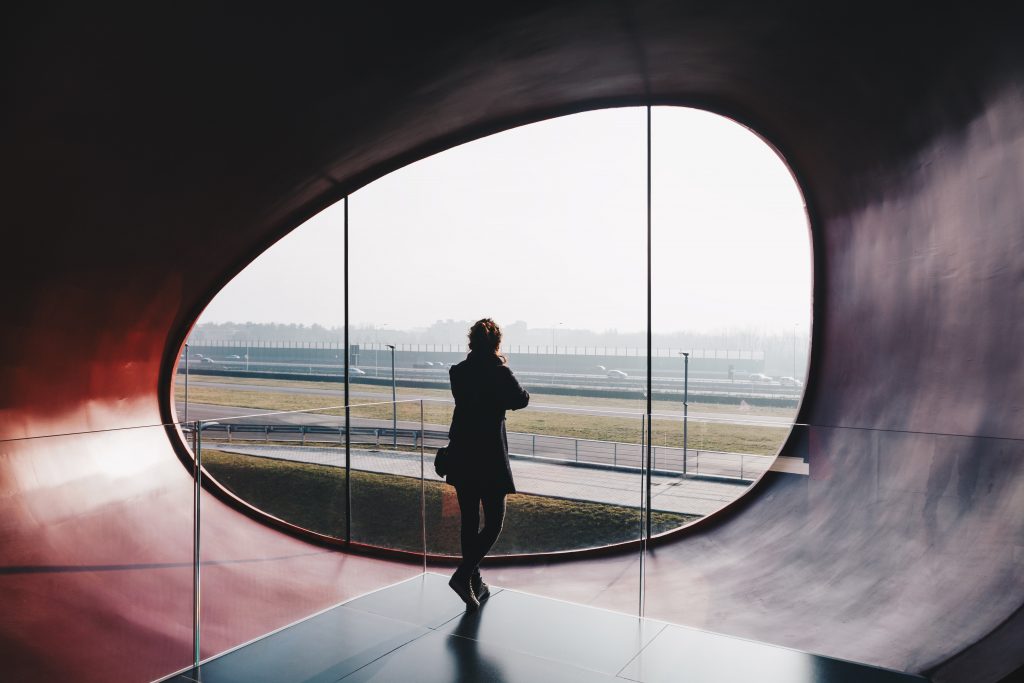 November Reading List Week 2, girl standing in front of circle window