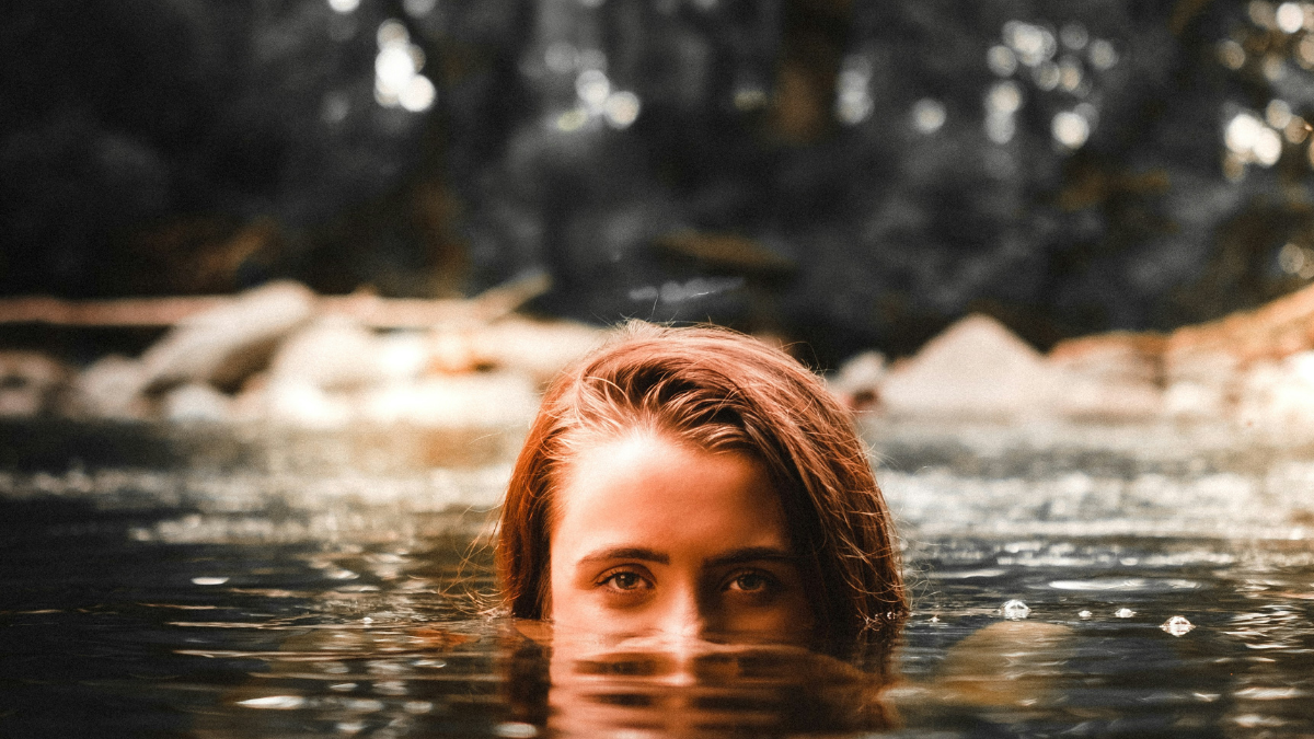 girl trying to stay afloat and not drown