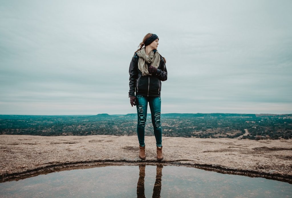 person looking out at reflection, no answers just trust