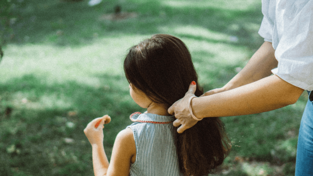 mom doing her daughter's hair