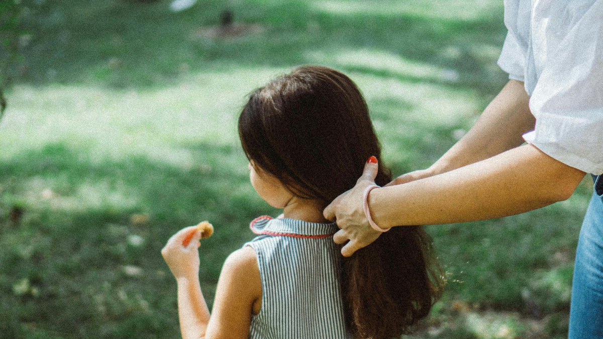 mom doing her daughter's hair