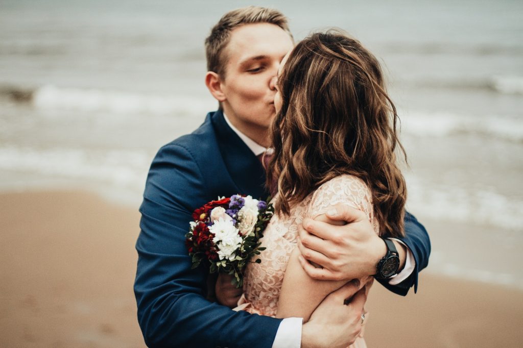 happy couple on beach, never regret loving with all of me