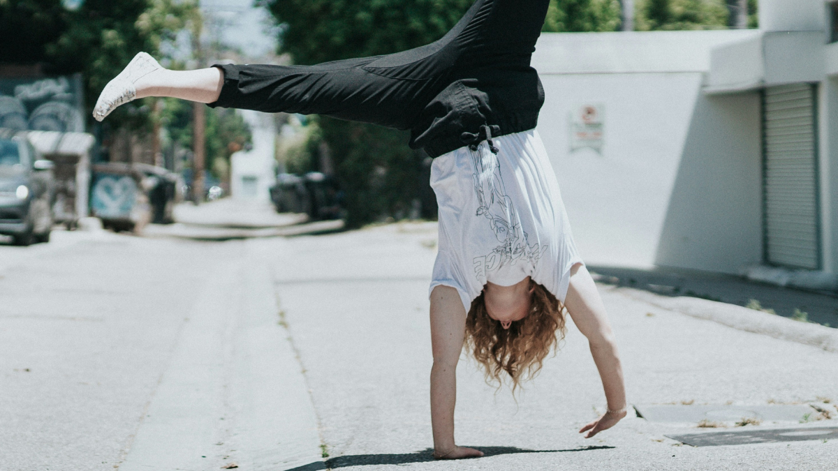 person cartwheeling and having fun