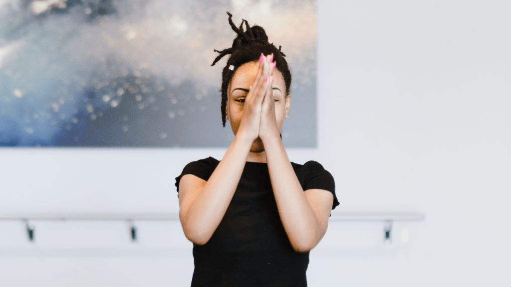 woman doing yoga learning to stop apologizing