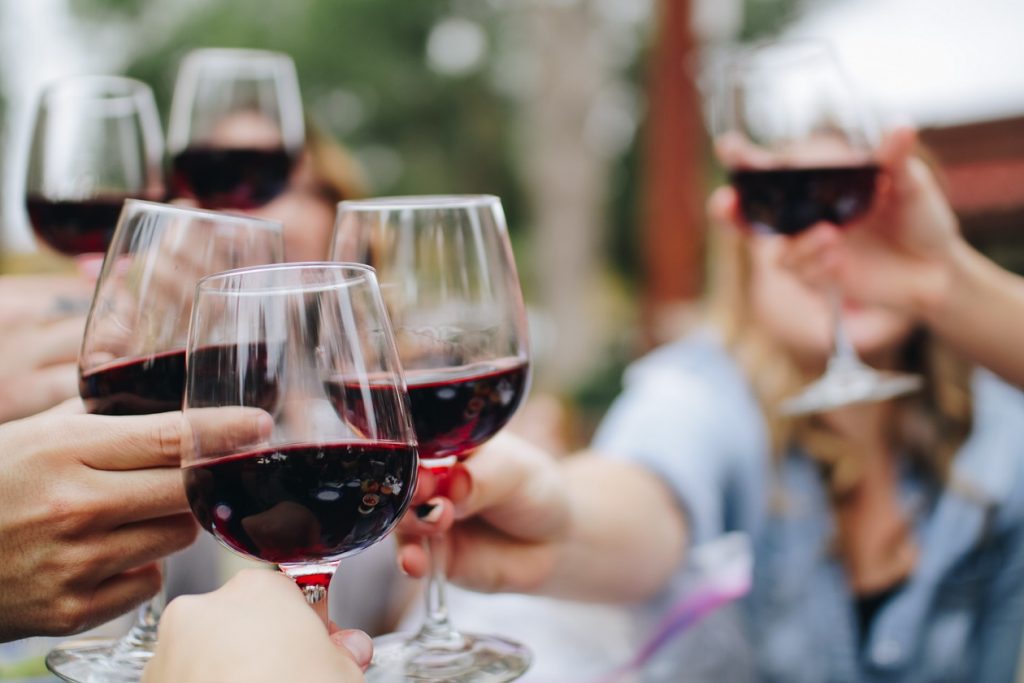 people holding out best wine pairings