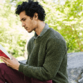man reading book alone giving self-love