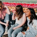 girls laughing and sitting together