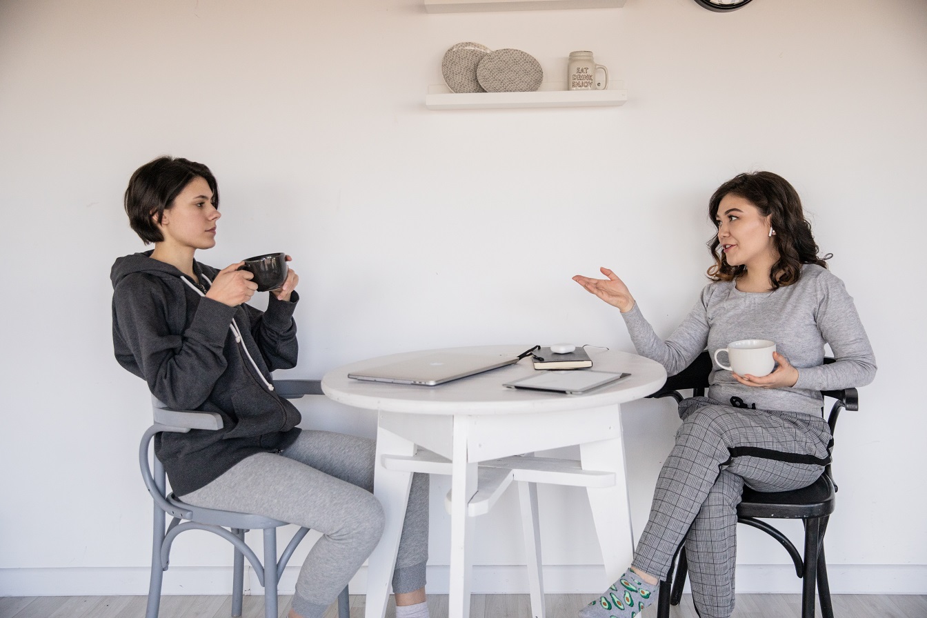 women talking over coffee