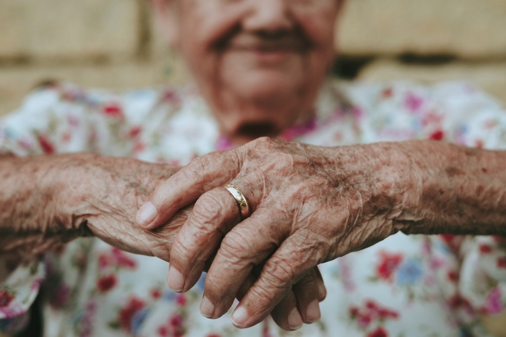 older woman with crossed hands