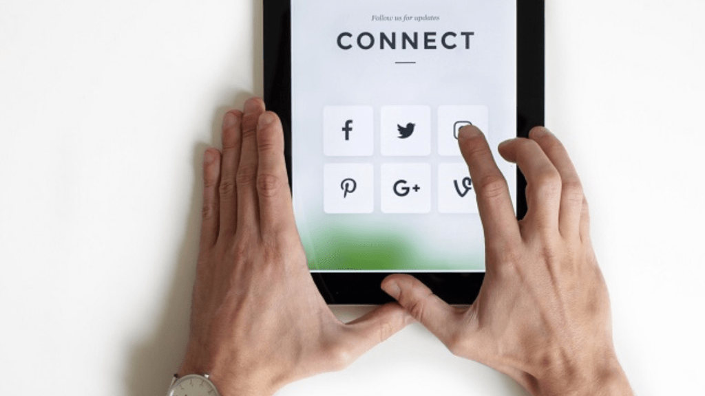 person holding an iPad trying to stay safe online