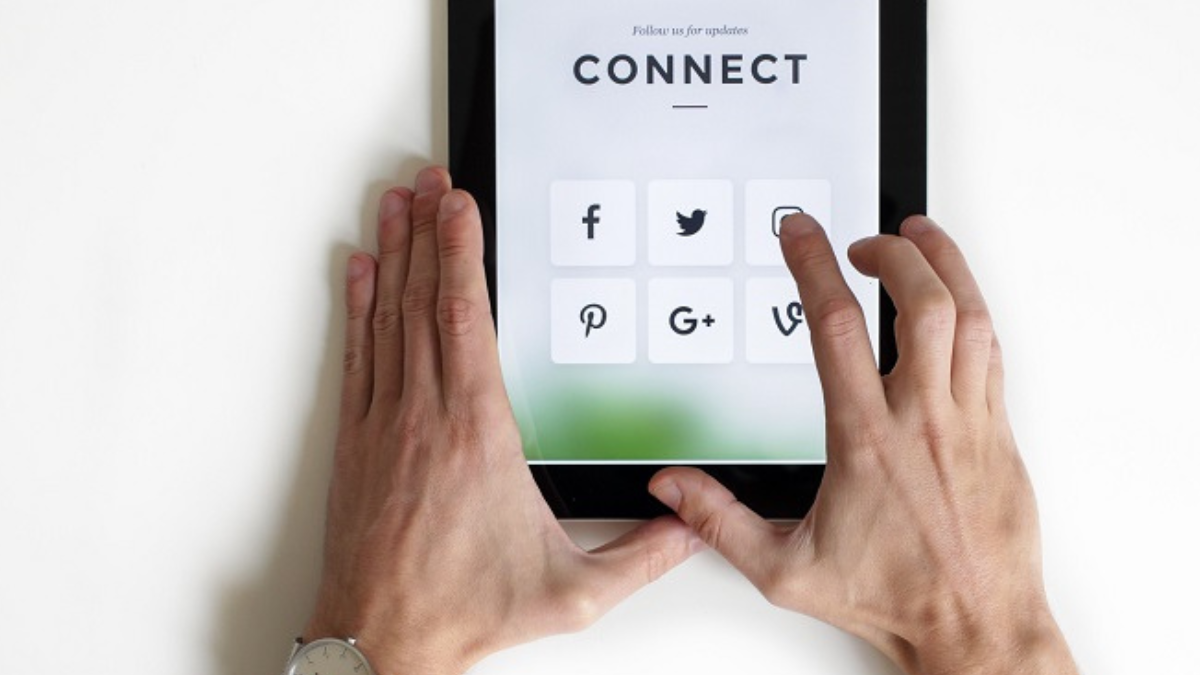 person holding an iPad trying to stay safe online