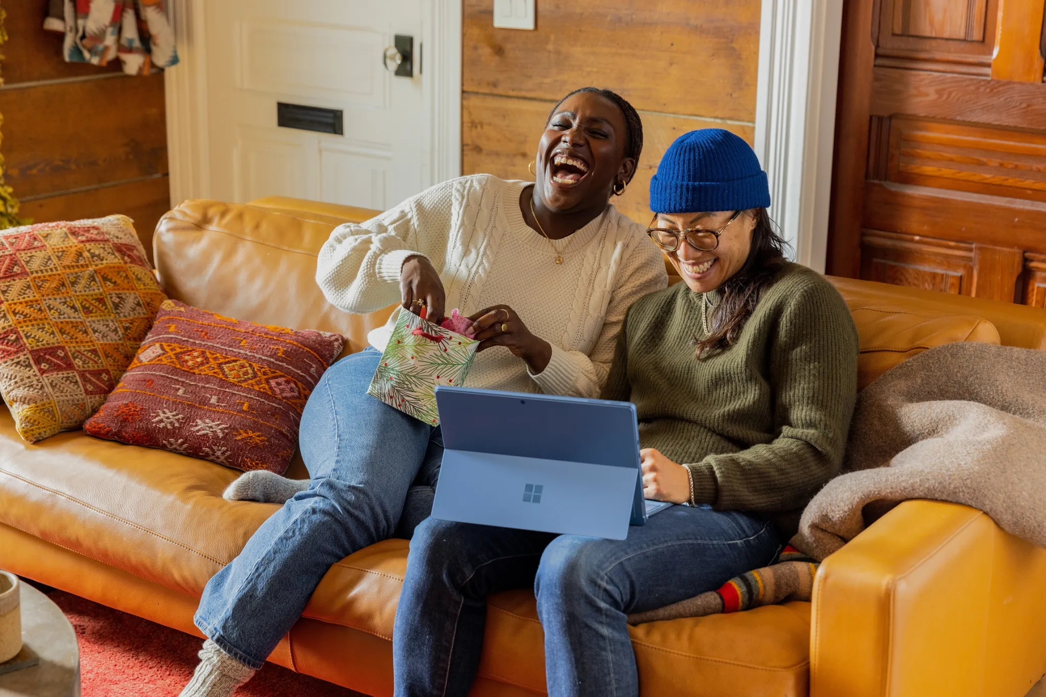 happy people laughing on couch