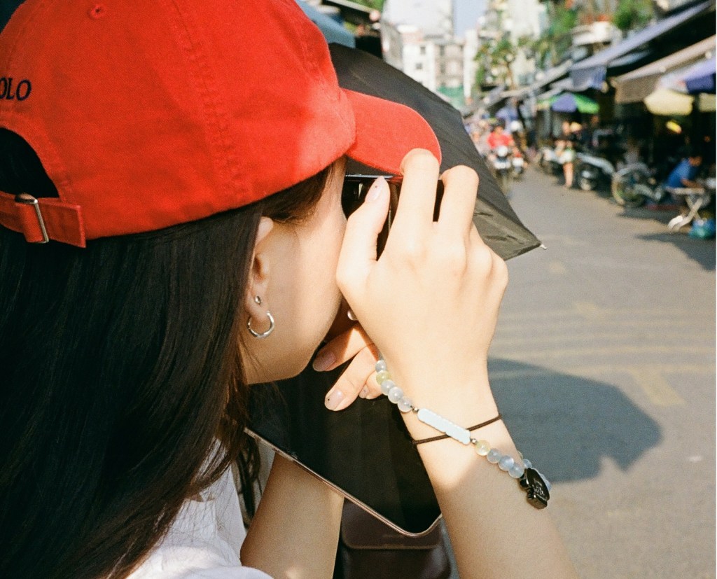 girl taking pictures in natural light